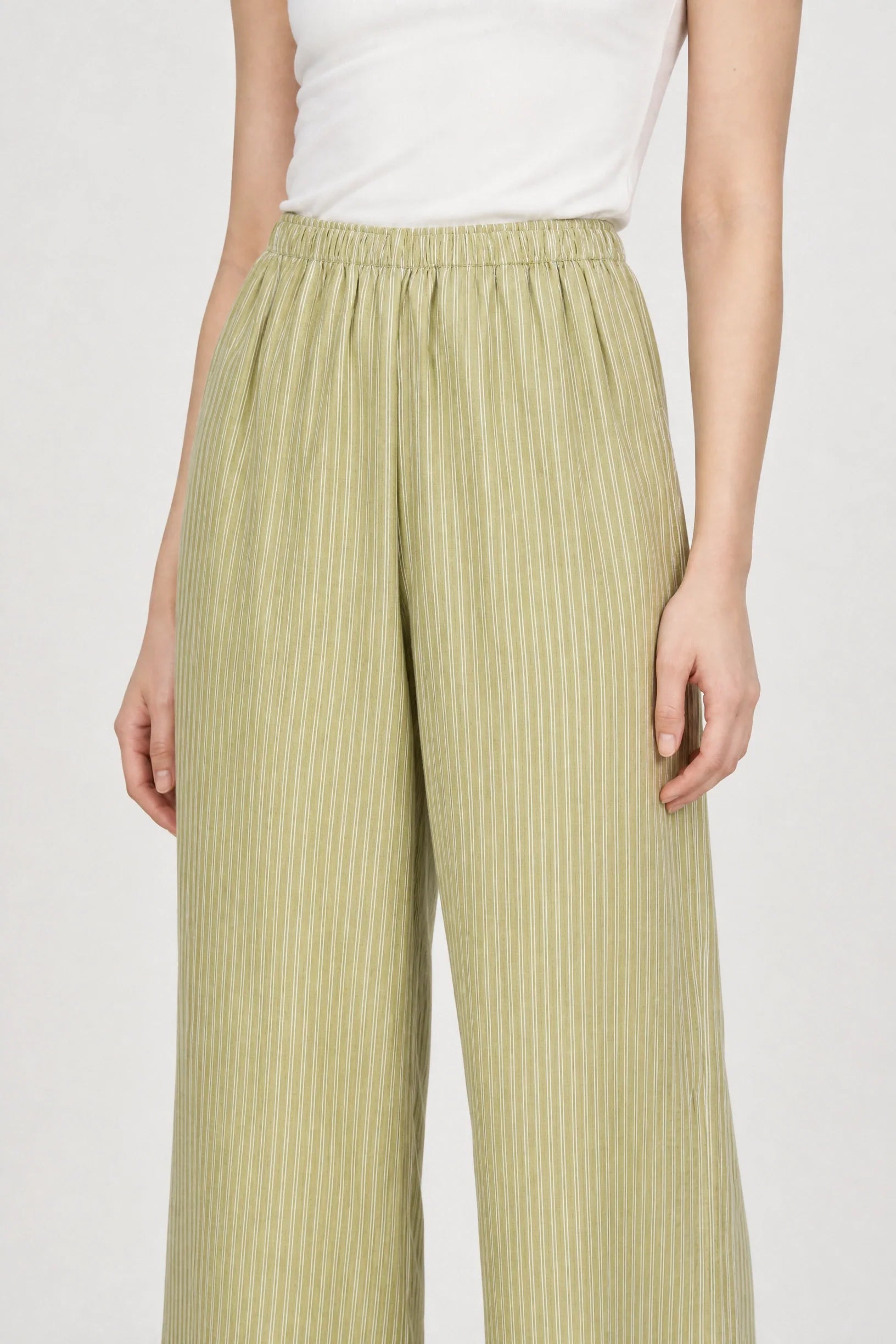 Olive green and white vertical striped relaxed trousers
