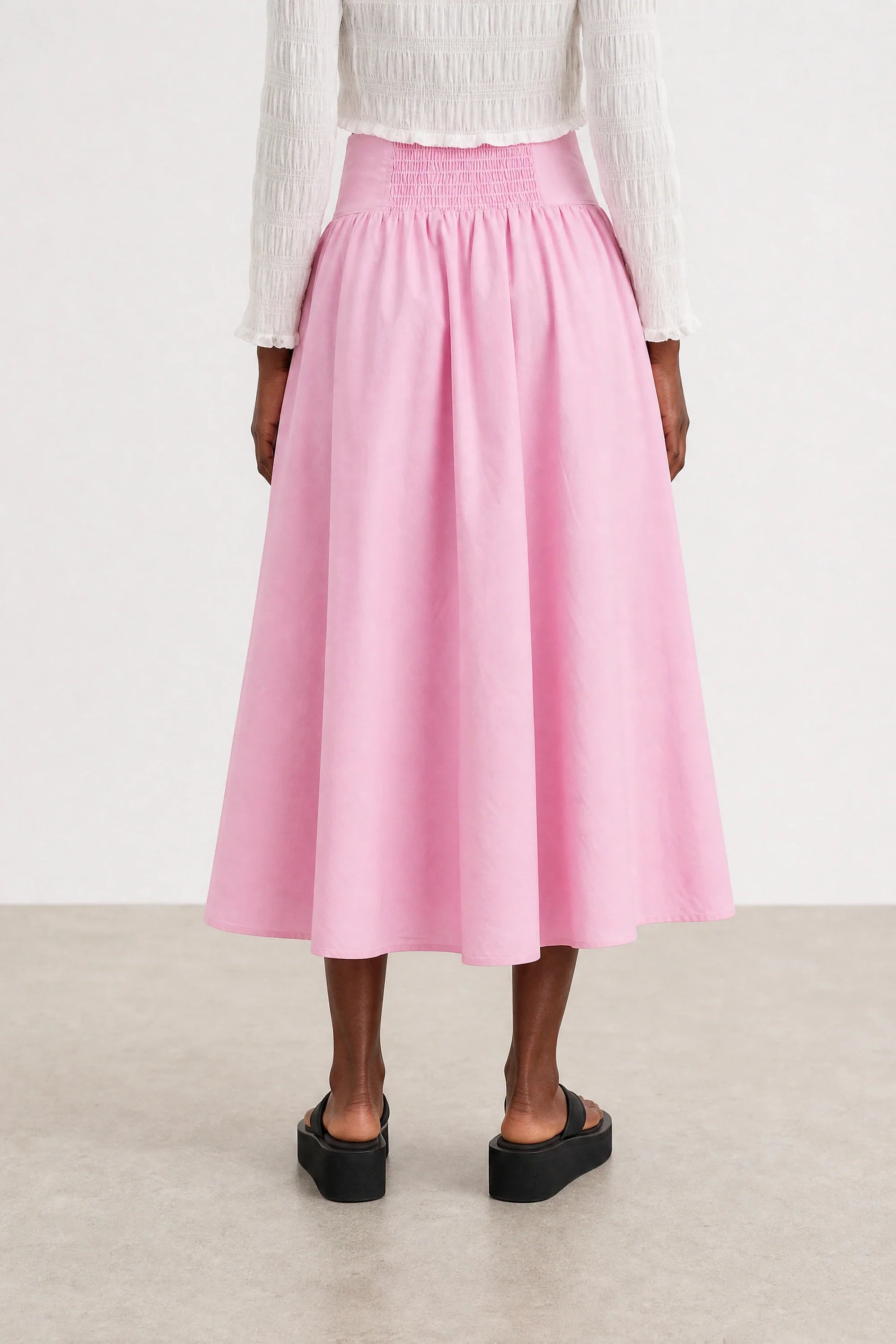 Pale pink drop waist midi skirt