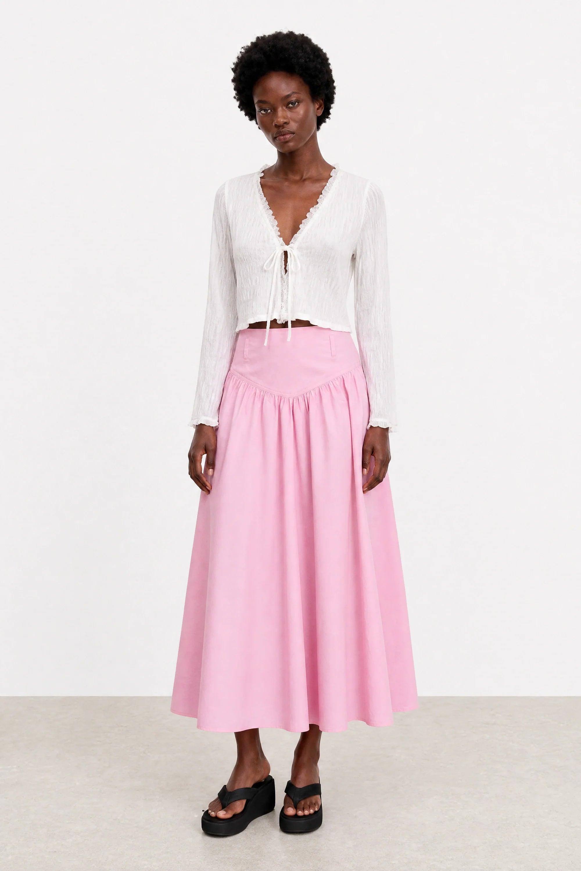 Pale pink drop waist midi skirt