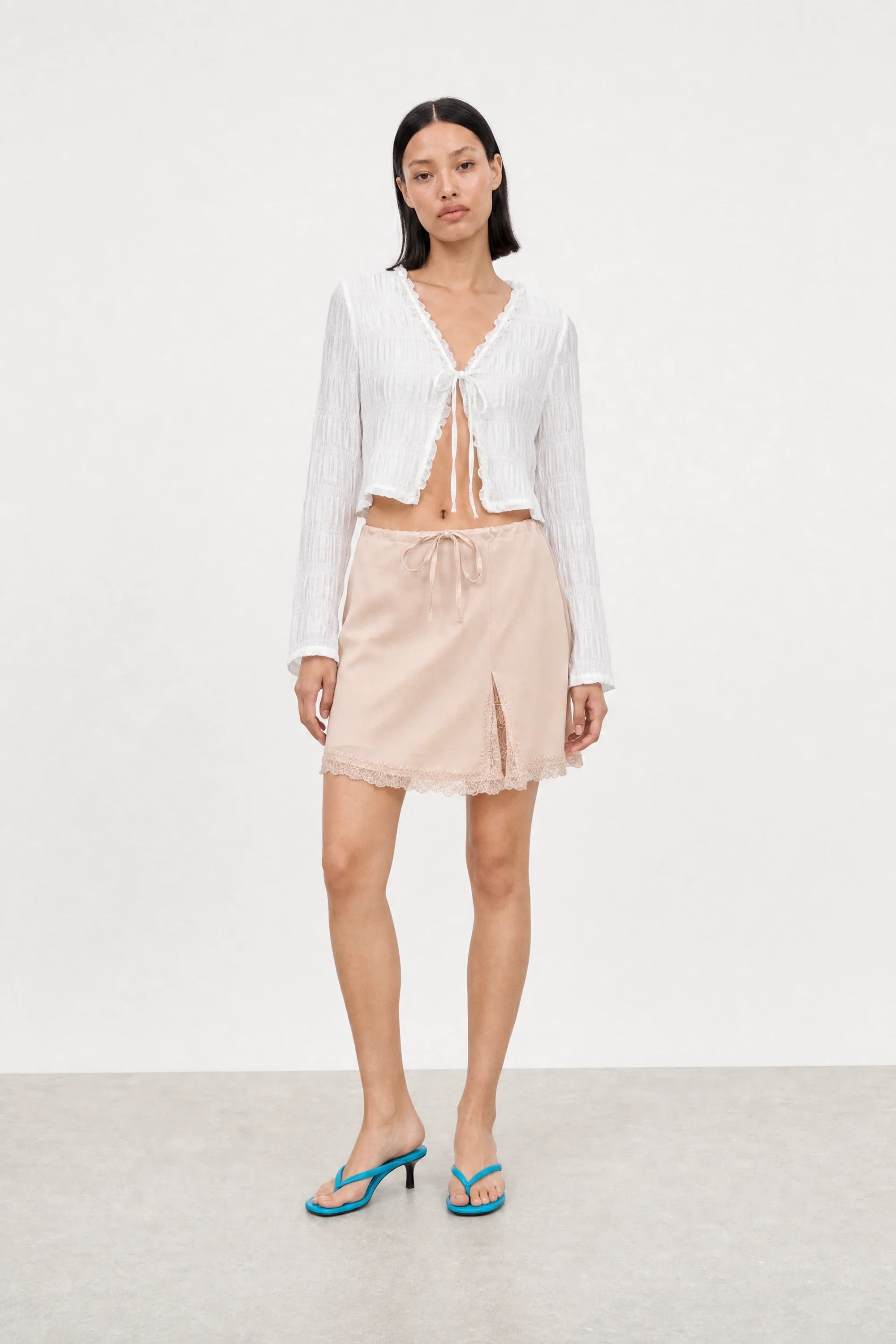 Pale pink lace trim mini slip skirt