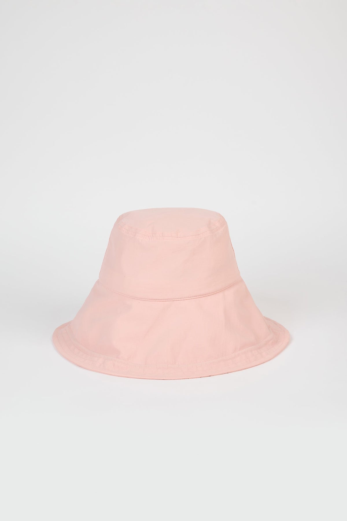 Pale pink nylon wide brim bucket hat