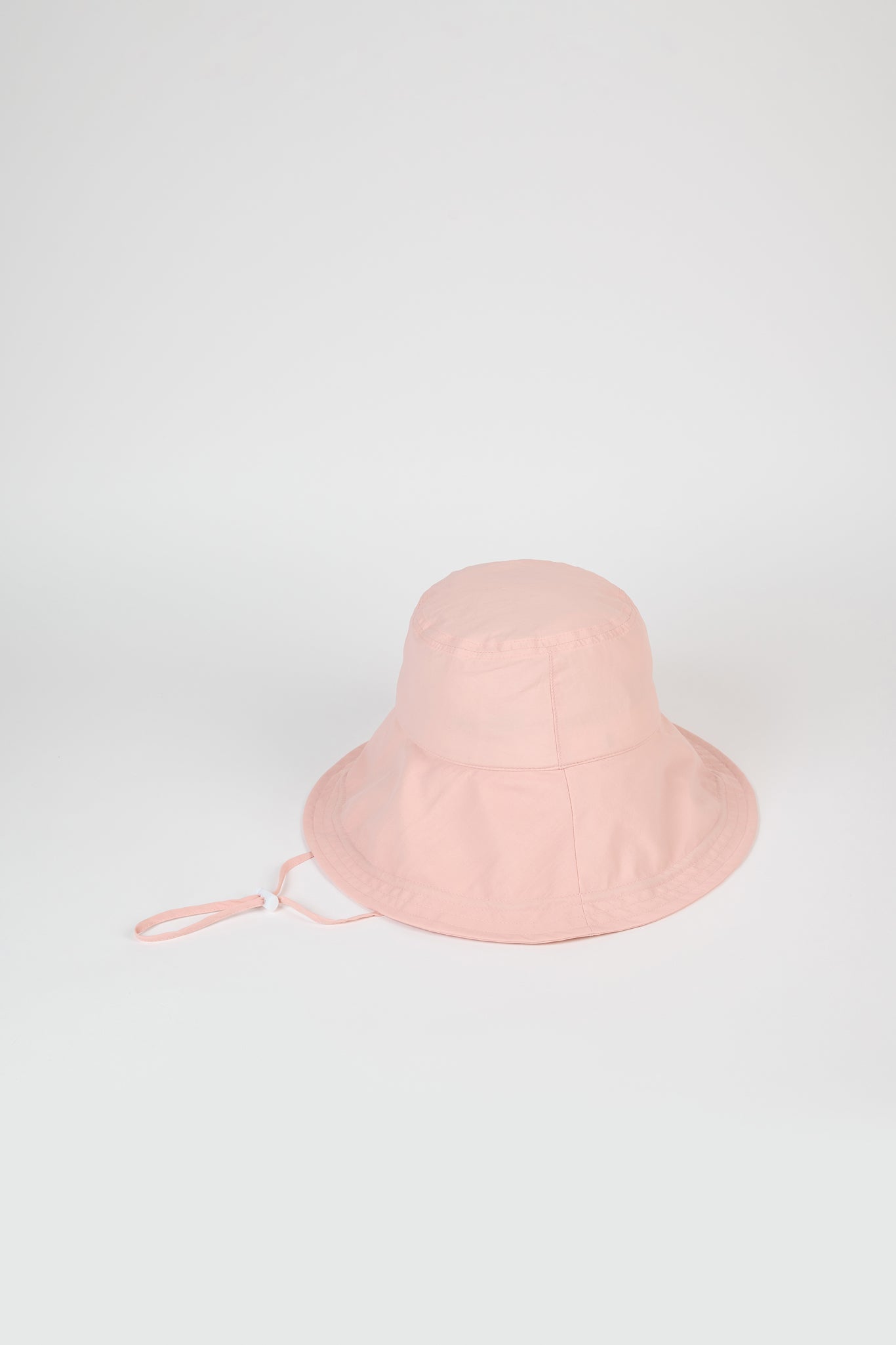 Pale pink nylon wide brim bucket hat