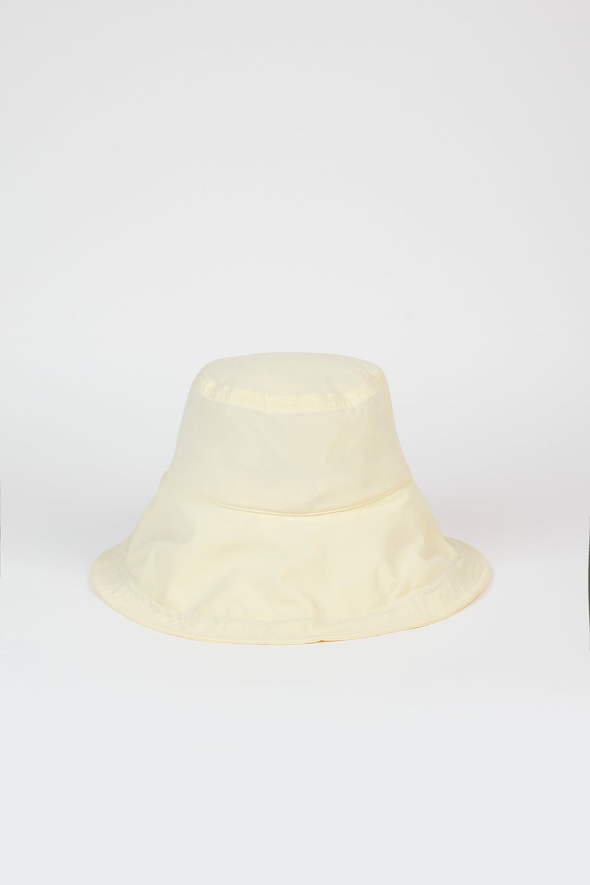 Pale yellow nylon wide brim bucket hat
