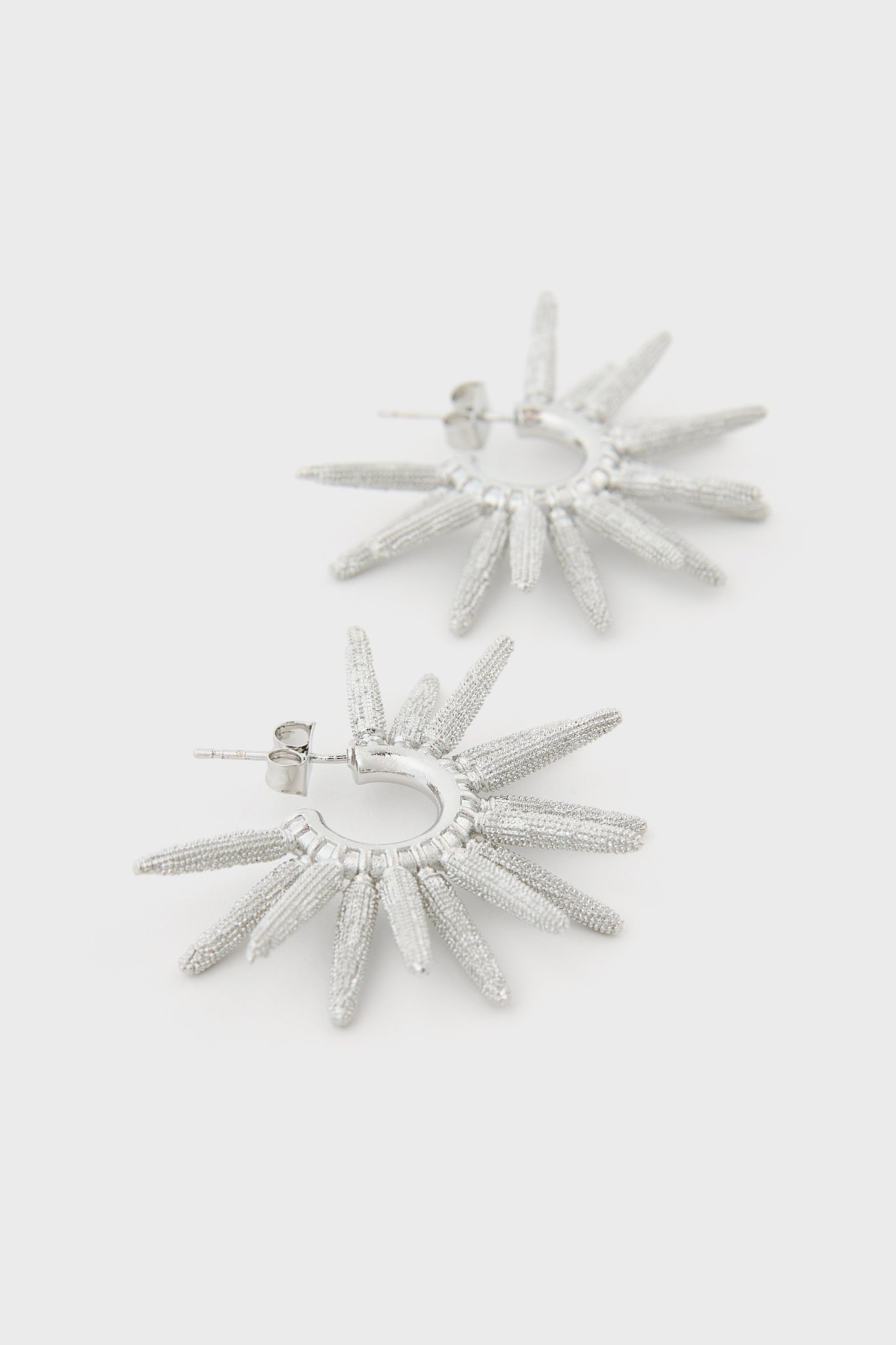 Silver thick cones starbust hoop earrings