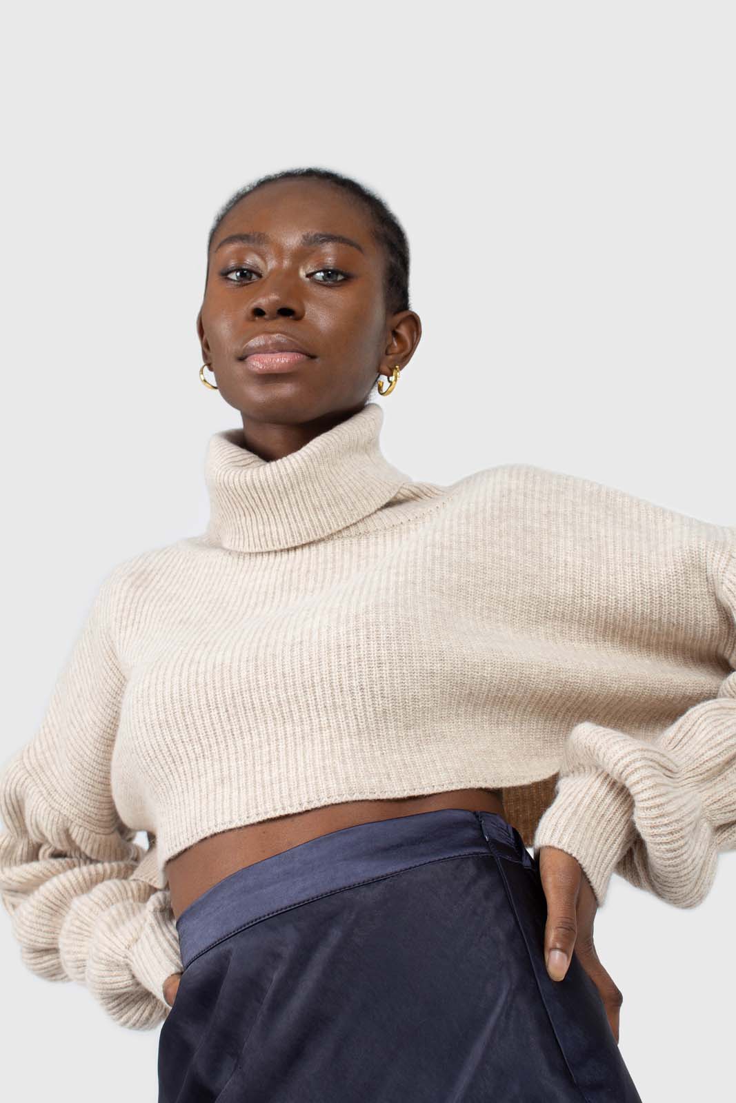 Beige balloon sleeved cropped wool blend turtleneck top