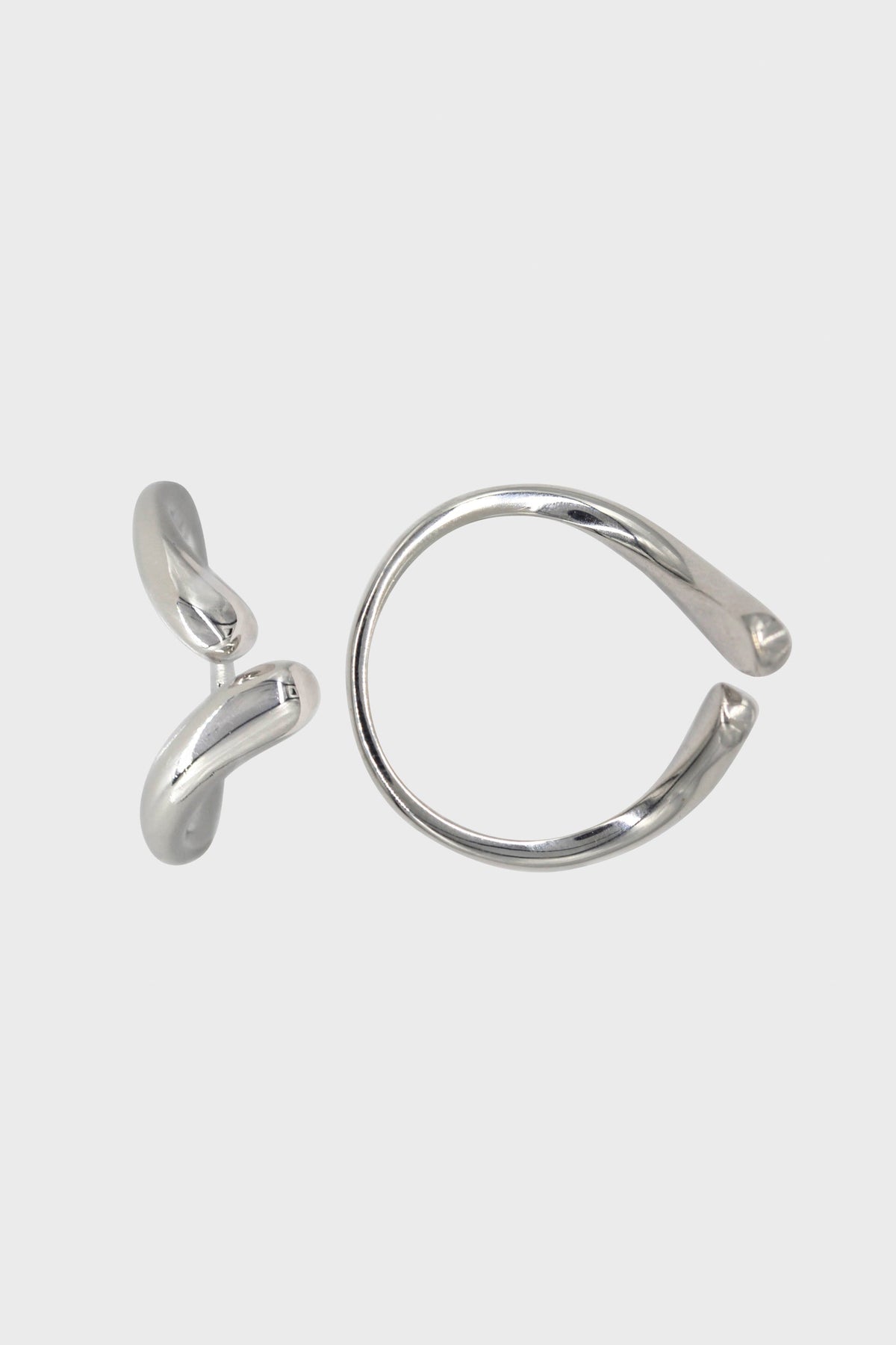 Silver colliding tear drops ring