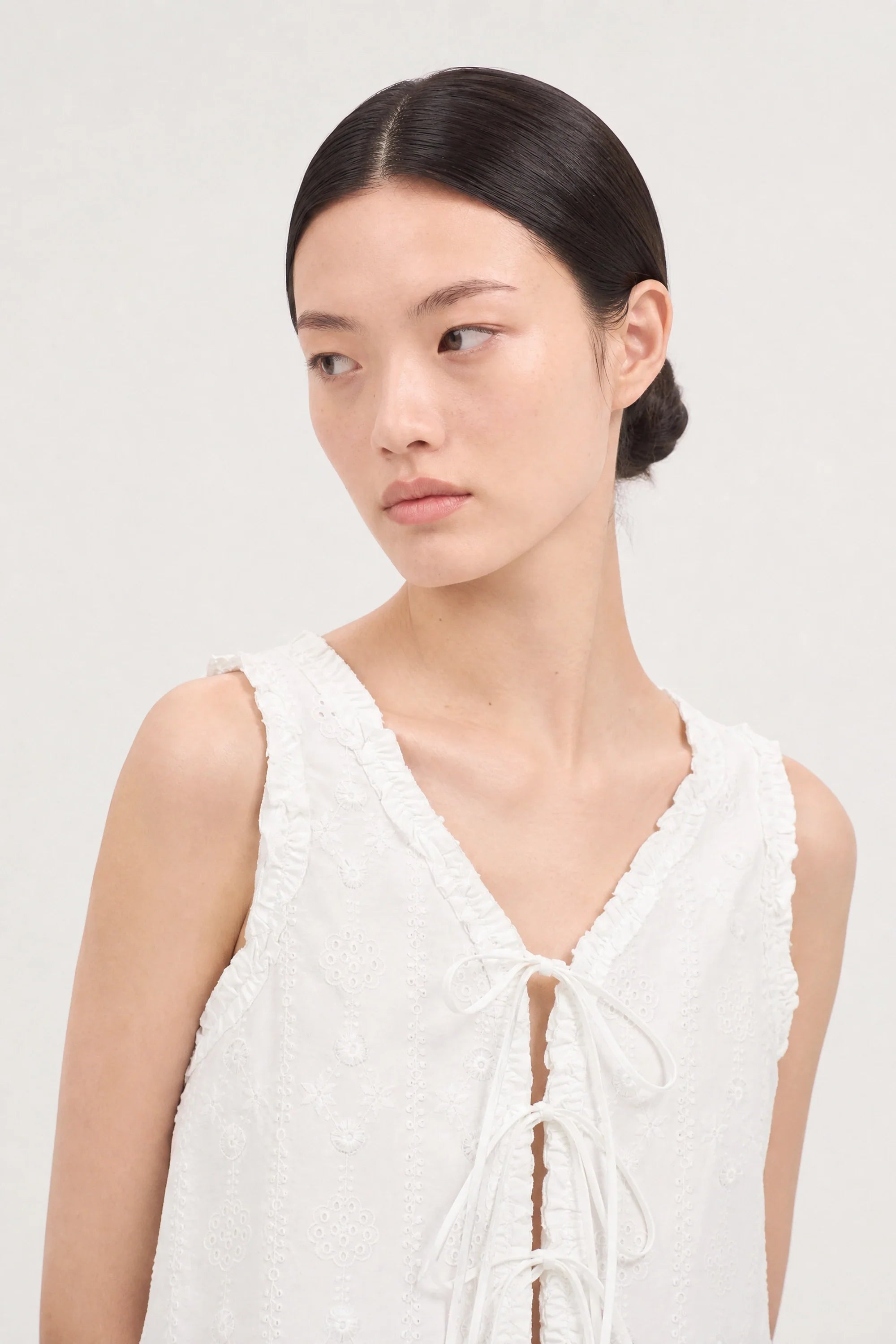 White embroidered tie front sleeveless top