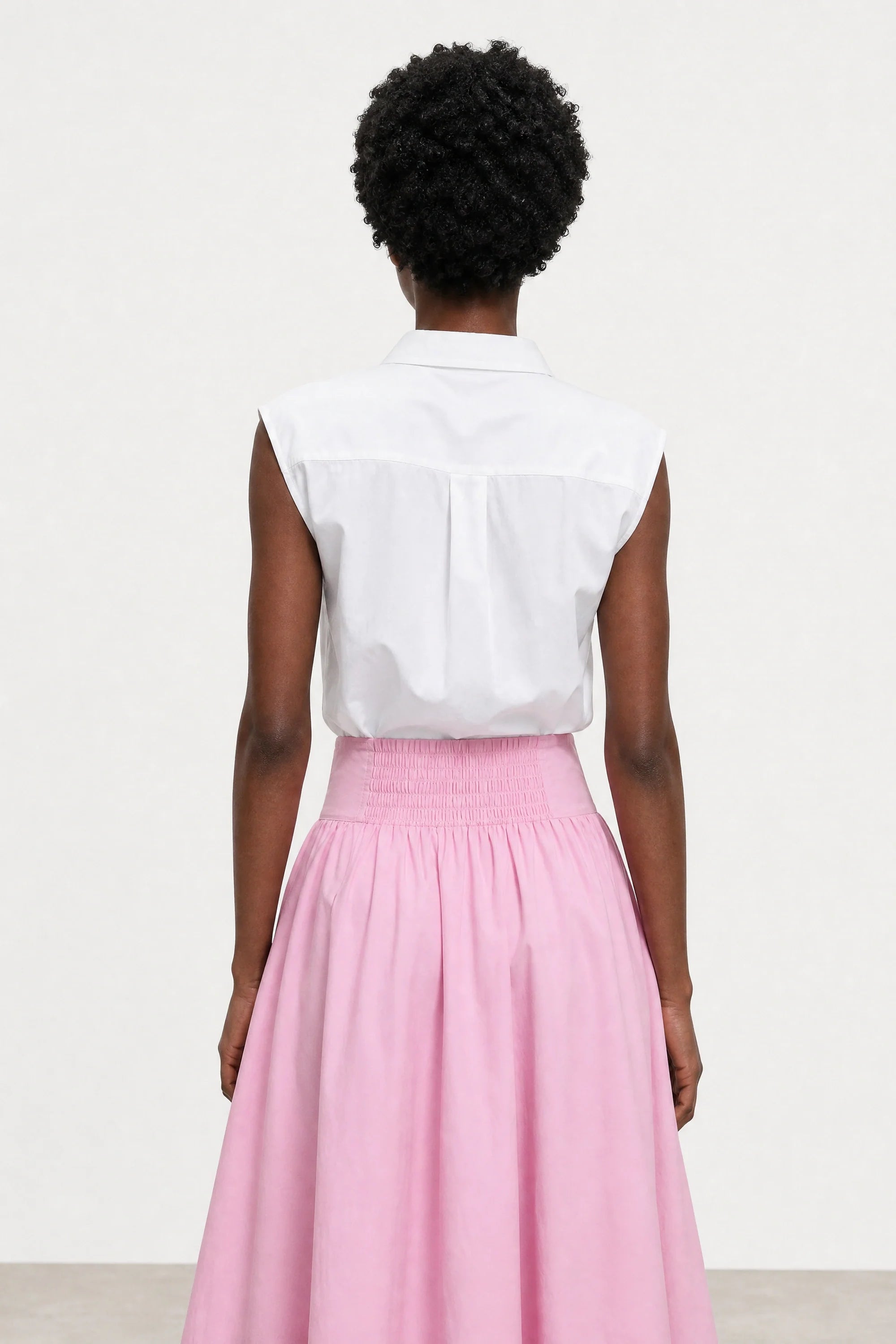 White loose panel back sleeveless shirt