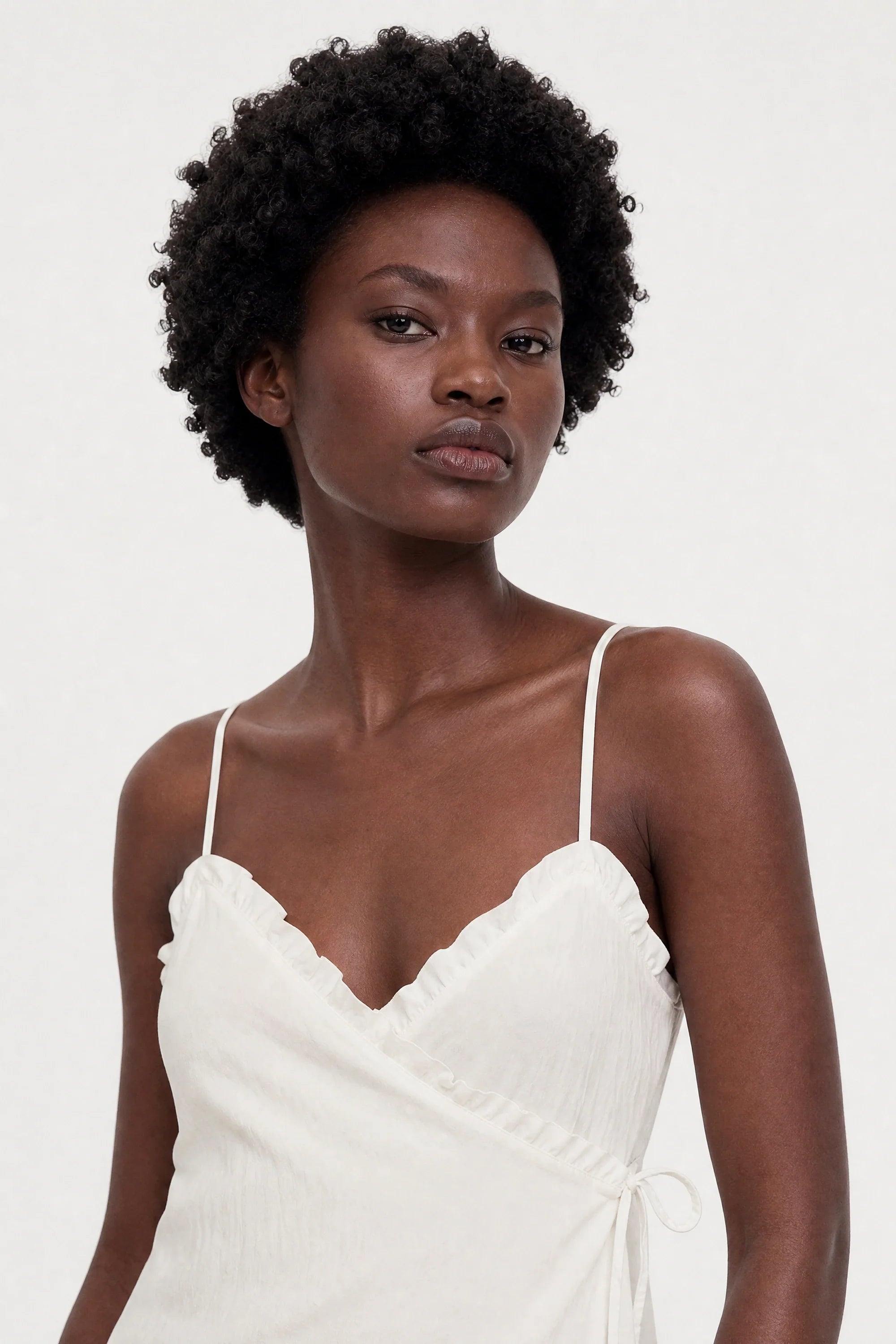 White ruffle trim tie waist tank