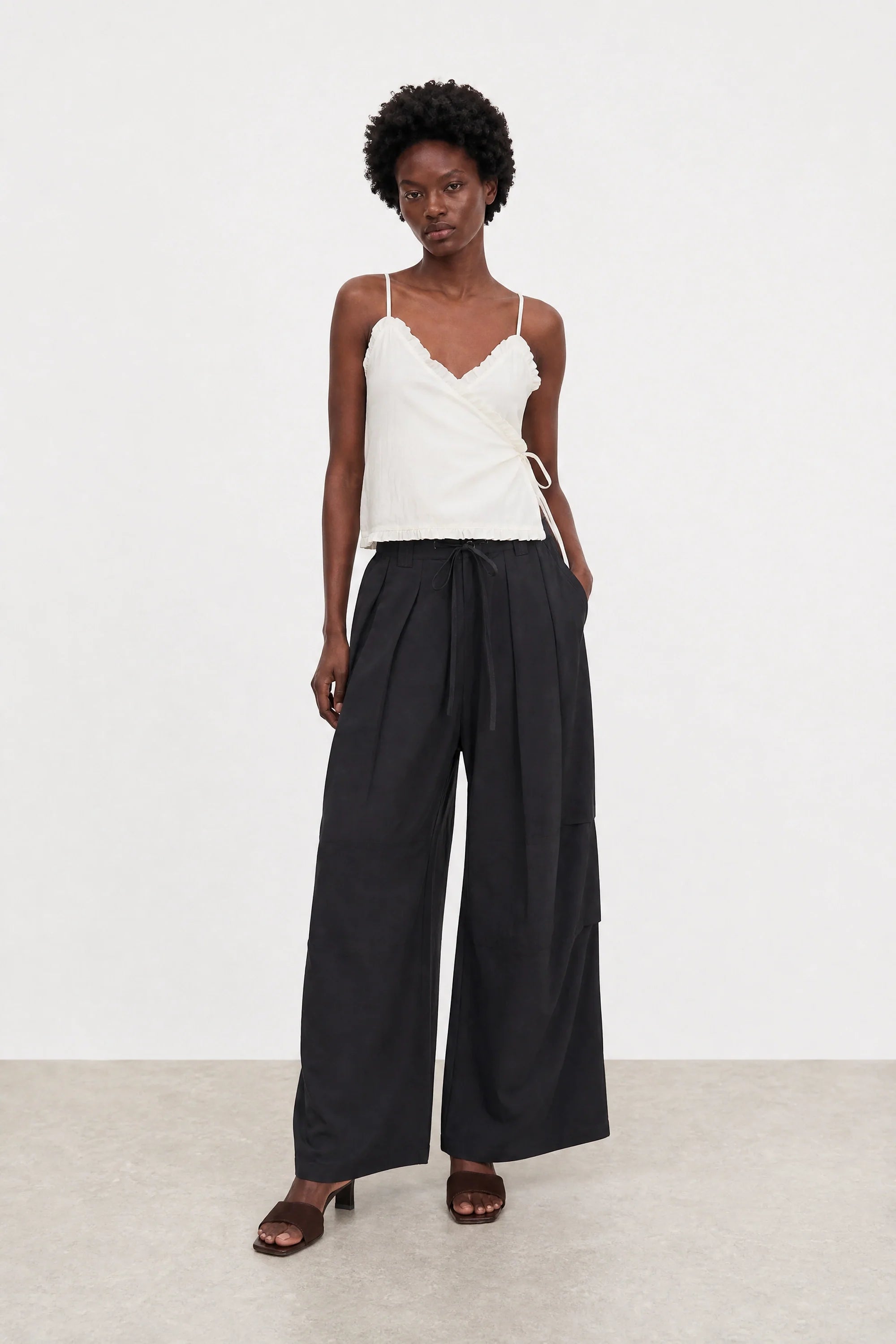 White ruffle trim tie waist tank