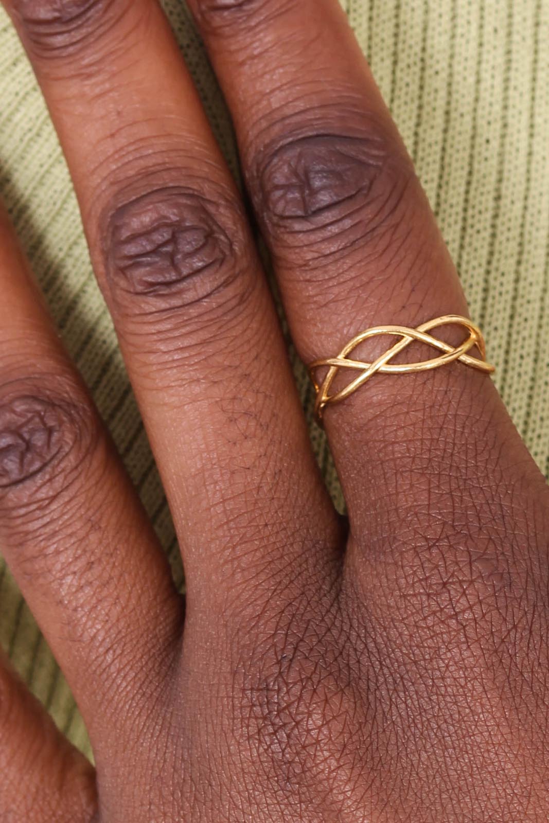 Gold interwoven strands ring